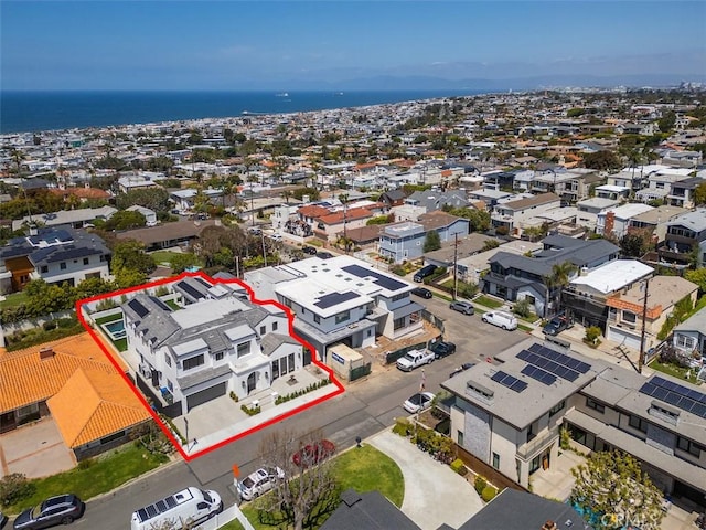 birds eye view of property featuring a residential view and a water view
