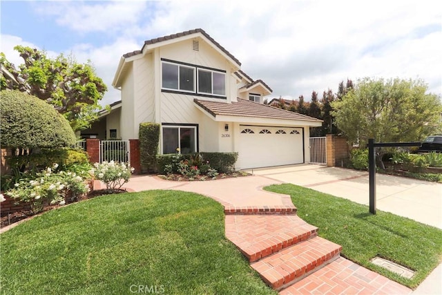 traditional home with a gate, fence, driveway, and a tile roof