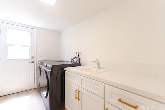26306 Ganiza, Mission Viejo, CA 92692 - clothes washing area with cabinet space, washing machine and dryer, and light wood-style floors