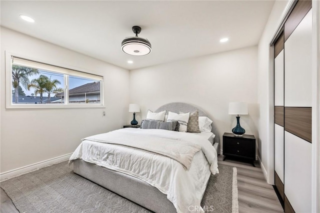 5591 Heil Ave, Huntington Beach, CA 92649 - bedroom with light wood-type flooring, baseboards, and recessed lighting