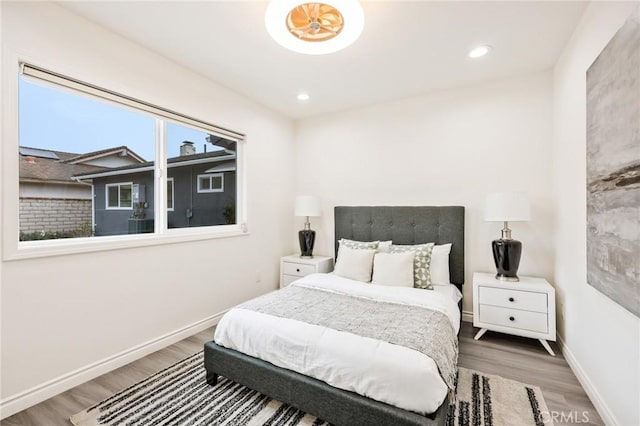 5591 Heil Ave, Huntington Beach, CA 92649 - bedroom with wood finished floors, baseboards, and recessed lighting
