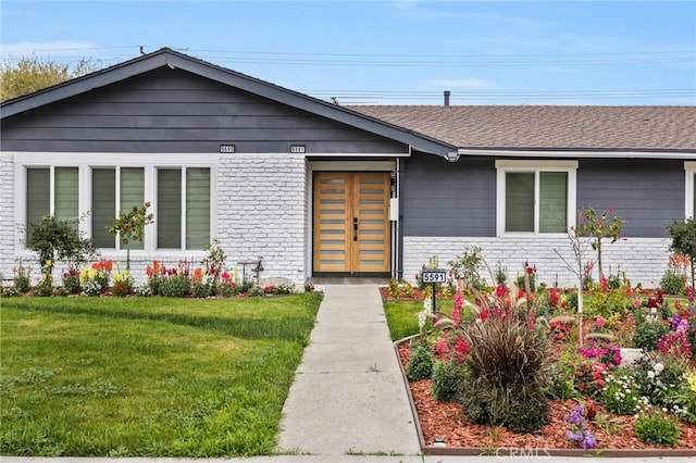 5591 Heil Ave, Huntington Beach, CA 92649 - view of front of property featuring brick siding, a front lawn, and a shingled roof