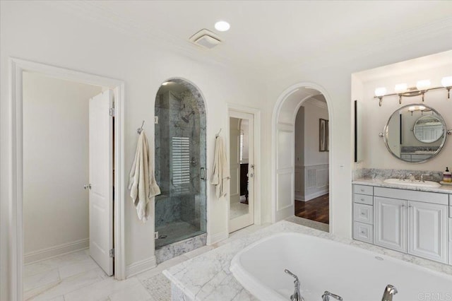 full bath with ornamental molding, a bath, and a stall shower