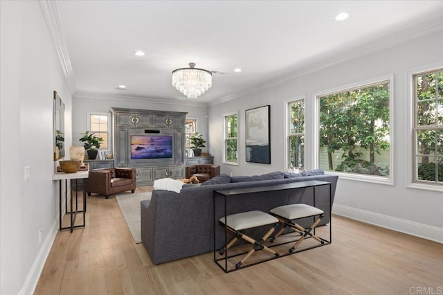 living area featuring a wealth of natural light, light wood-style flooring, and baseboards