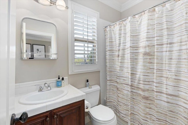 bathroom with toilet, curtained shower, vanity, and ornamental molding