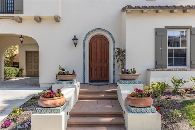 doorway to property with stucco siding