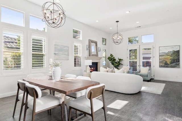 dining area featuring a chandelier, baseboards, dark wood-type flooring, visible vents, and recessed lighting