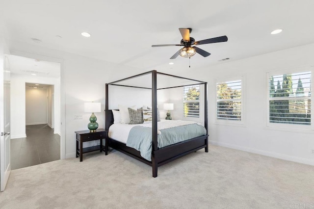 carpeted bedroom with visible vents, baseboards, and recessed lighting