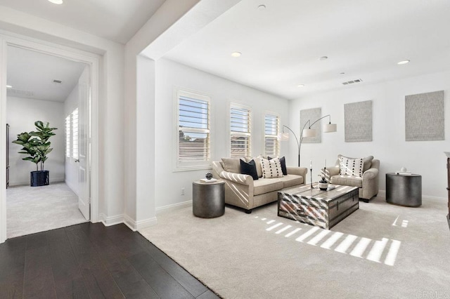 living area featuring wood-type flooring, baseboards, carpet flooring, visible vents, and recessed lighting