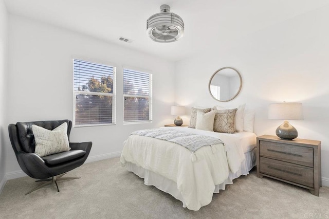 bedroom with baseboards, visible vents, and carpet flooring