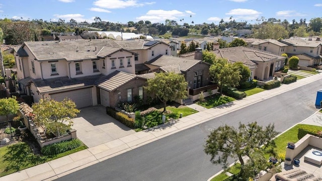 birds eye view of property with a residential view