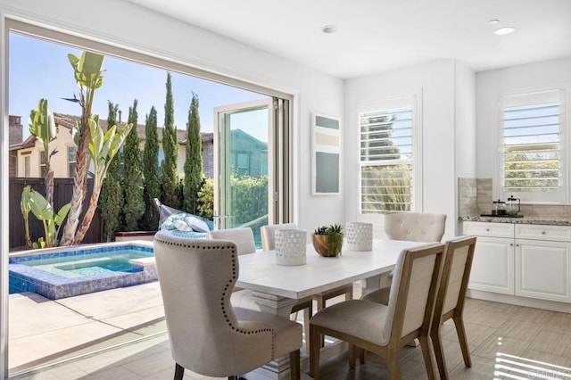 dining area featuring recessed lighting