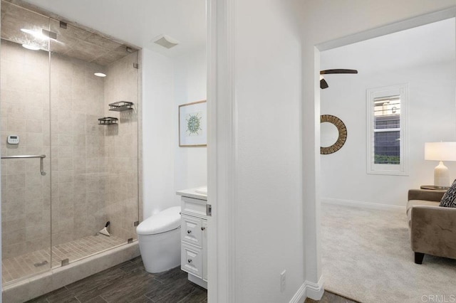 bathroom featuring visible vents, toilet, baseboards, and a stall shower