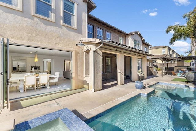 715 Blossom Rd, Encinitas, CA 92024 - rear view of property with stucco siding, an outdoor pool, and a patio