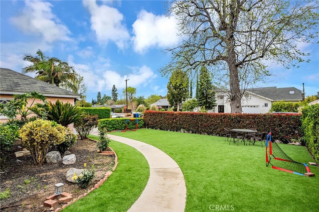 surrounding community featuring a yard