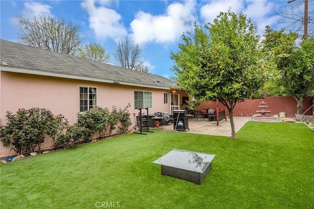 view of yard with a patio and fence