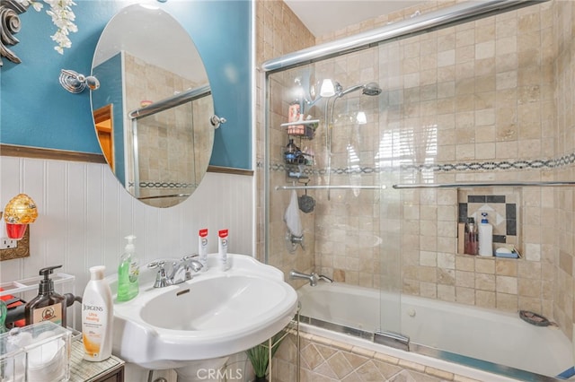 full bath with a sink and tiled shower / bath