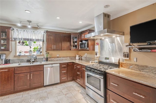 kitchen featuring island range hood, a sink, crown molding, and stainless steel appliances