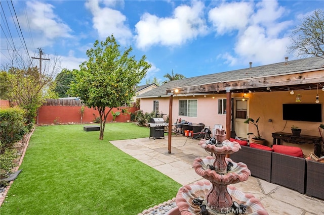 rear view of property featuring stucco siding, an outdoor living space, a patio area, fence, and a lawn