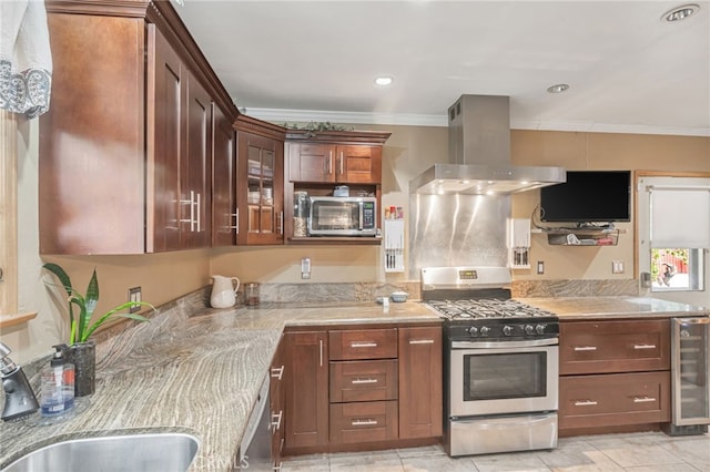kitchen with appliances with stainless steel finishes, island exhaust hood, crown molding, wine cooler, and a sink