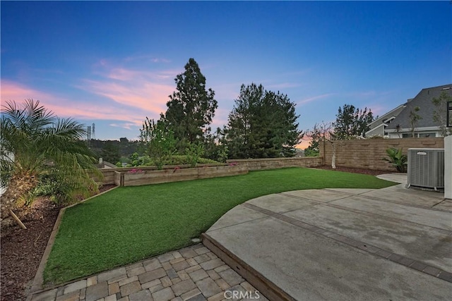 21302 Bishop, Mission Viejo, CA 92692 - yard at dusk featuring central AC and a patio area