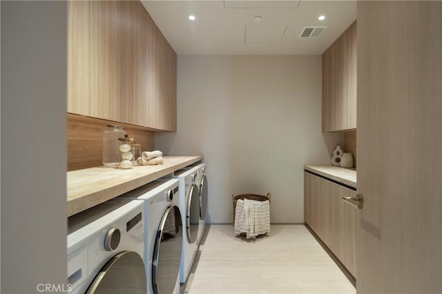 17177 Adlon Rd, Encino, CA 91436 - laundry room with visible vents, cabinet space, recessed lighting, light wood-style flooring, and washer and clothes dryer