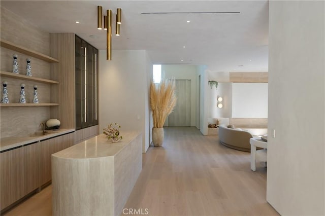 17177 Adlon Rd, Encino, CA 91436 - corridor with light wood-style floors and built in features