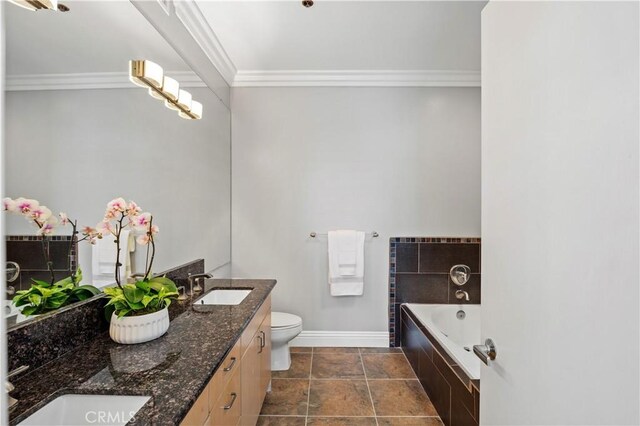 5350 Sepulveda Blvd Unit 15, Sherman Oaks, CA 91411 - full bathroom featuring crown molding, baseboards, a garden tub, double vanity, and toilet