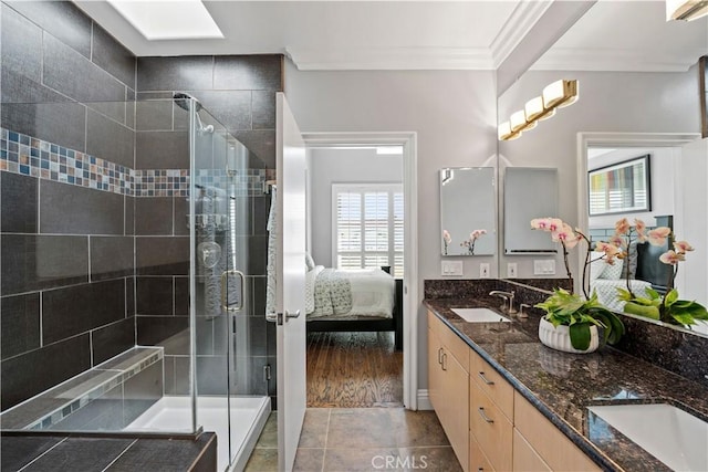 5350 Sepulveda Blvd Unit 15, Sherman Oaks, CA 91411 - full bath with crown molding, double vanity, connected bathroom, a stall shower, and tile patterned flooring