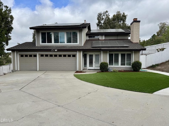 571 Citation Way, Newbury Park, CA 91320 - prairie-style house with concrete driveway, a front lawn, fence, and solar panels