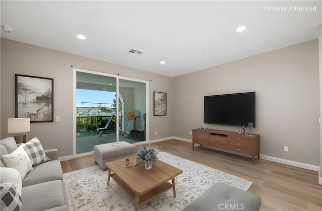 11118 Bunker Ln, Whittier, CA 90604 - living area with light wood finished floors, baseboards, and recessed lighting
