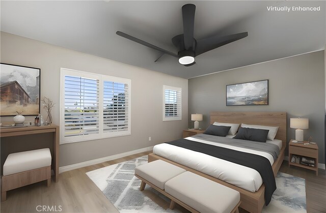 bedroom featuring baseboards, a ceiling fan, and wood finished floors