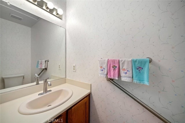 2344 Snowberry Ct, Avila Beach, CA 93424 - bathroom featuring toilet, vanity, and visible vents