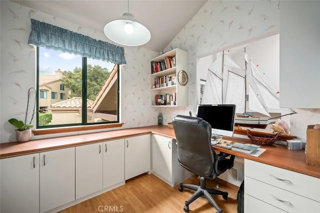 2344 Snowberry Ct, Avila Beach, CA 93424 - office area with wallpapered walls, light wood-style floors, lofted ceiling, and built in desk