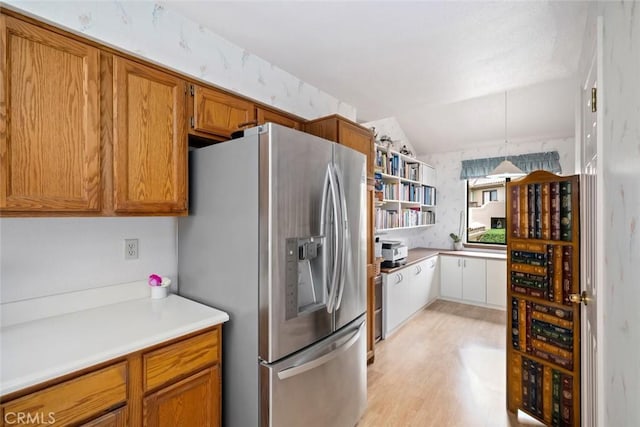 2344 Snowberry Ct, Avila Beach, CA 93424 - kitchen with light countertops, stainless steel fridge, brown cabinets, open shelves, and vaulted ceiling