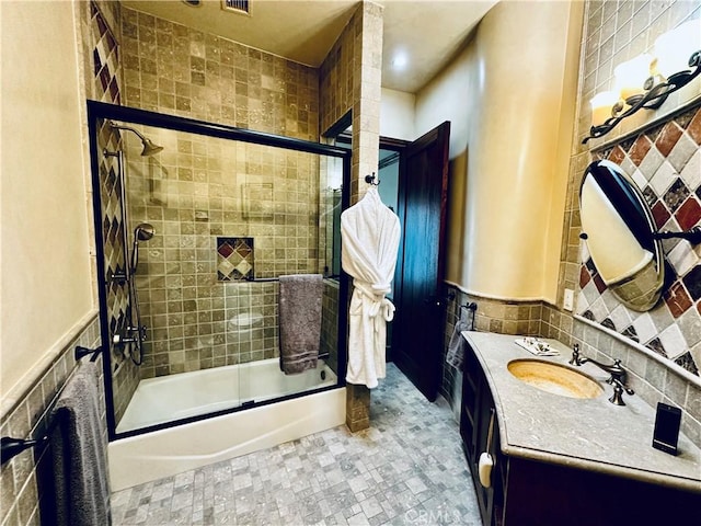2695 Shady Ridge Ln, Diamond Bar, CA 91765 - full bathroom featuring tile walls, vanity, enclosed tub / shower combo, and wainscoting