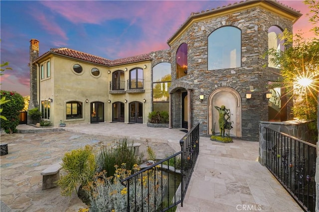 2695 Shady Ridge Ln, Diamond Bar, CA 91765 - mediterranean / spanish-style house featuring a balcony, french doors, a patio area, and a chimney