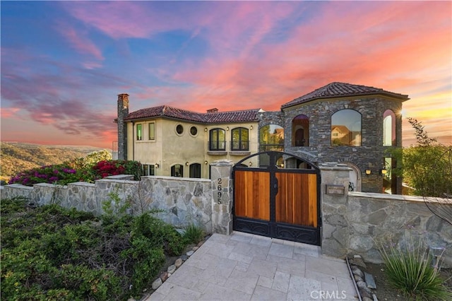 2695 Shady Ridge Ln, Diamond Bar, CA 91765 - mediterranean / spanish-style home with a gate, stucco siding, and a tiled roof