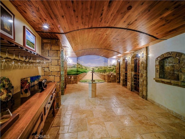 2695 Shady Ridge Ln, Diamond Bar, CA 91765 - hall featuring wood ceiling, stone tile floors, and baseboards