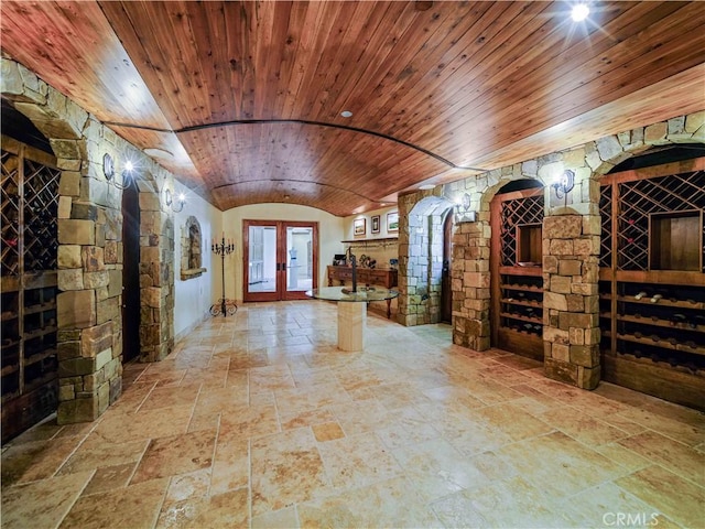 2695 Shady Ridge Ln, Diamond Bar, CA 91765 - wine area featuring wood ceiling, stone tile flooring, lofted ceiling, and french doors