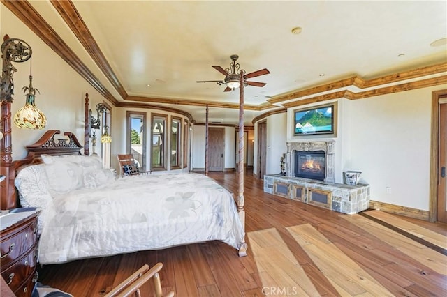 2695 Shady Ridge Ln, Diamond Bar, CA 91765 - bedroom with crown molding, a fireplace, hardwood / wood-style floors, baseboards, and a tray ceiling
