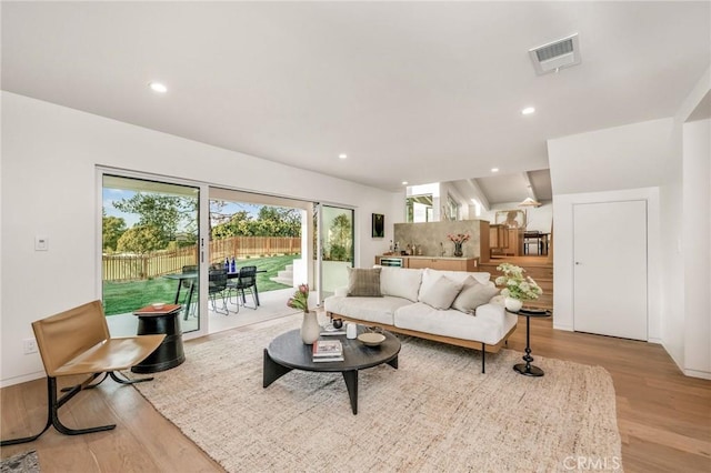 living area featuring wood finished floors, visible vents, and recessed lighting