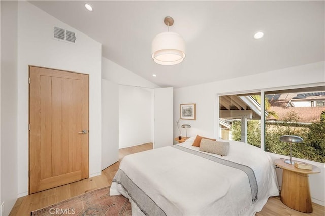 bedroom featuring lofted ceiling, light wood-style flooring, visible vents, and recessed lighting