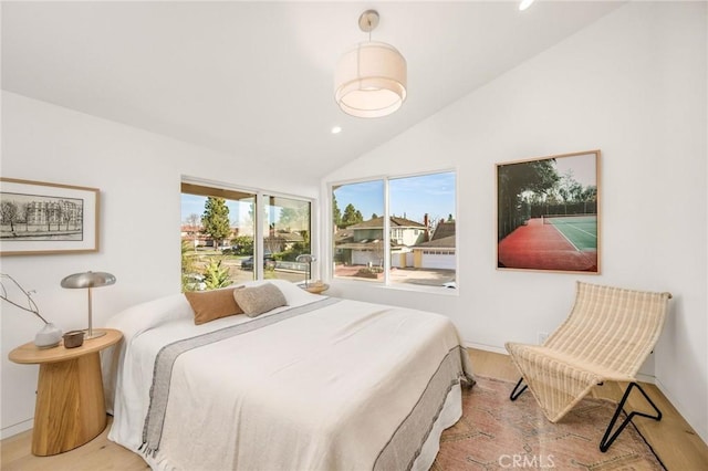 bedroom with baseboards, vaulted ceiling, wood finished floors, and recessed lighting