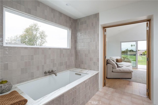 full bathroom with a garden tub