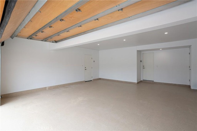 spare room featuring baseboards and recessed lighting