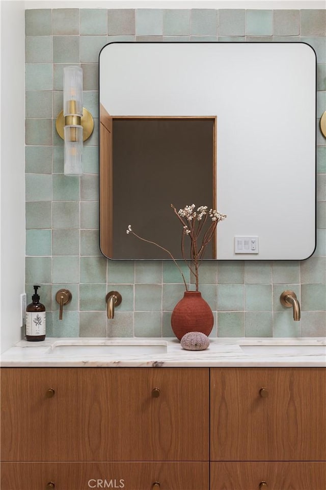 interior space featuring backsplash and vanity