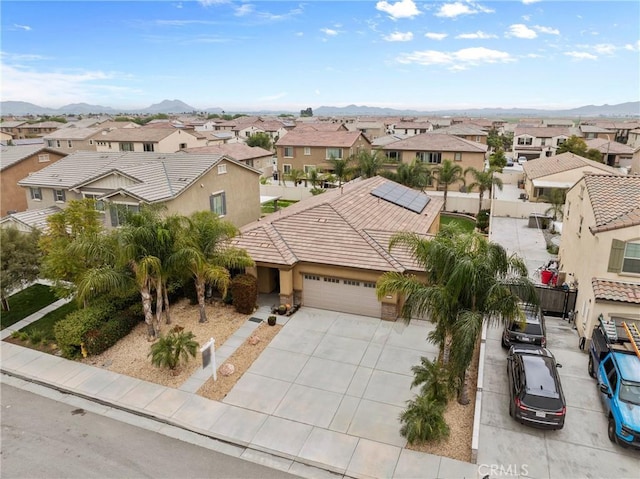 drone / aerial view with a mountain view and a residential view