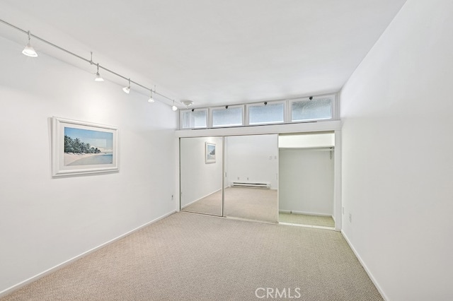 6 Voyage St Unit 204, Marina Del Rey, CA 90292 - below grade area featuring carpet floors, rail lighting, baseboards, and a baseboard heating unit