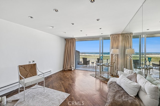 6 Voyage St Unit 204, Marina Del Rey, CA 90292 - living area with wood finished floors, a wall of windows, a baseboard heating unit, and a water view